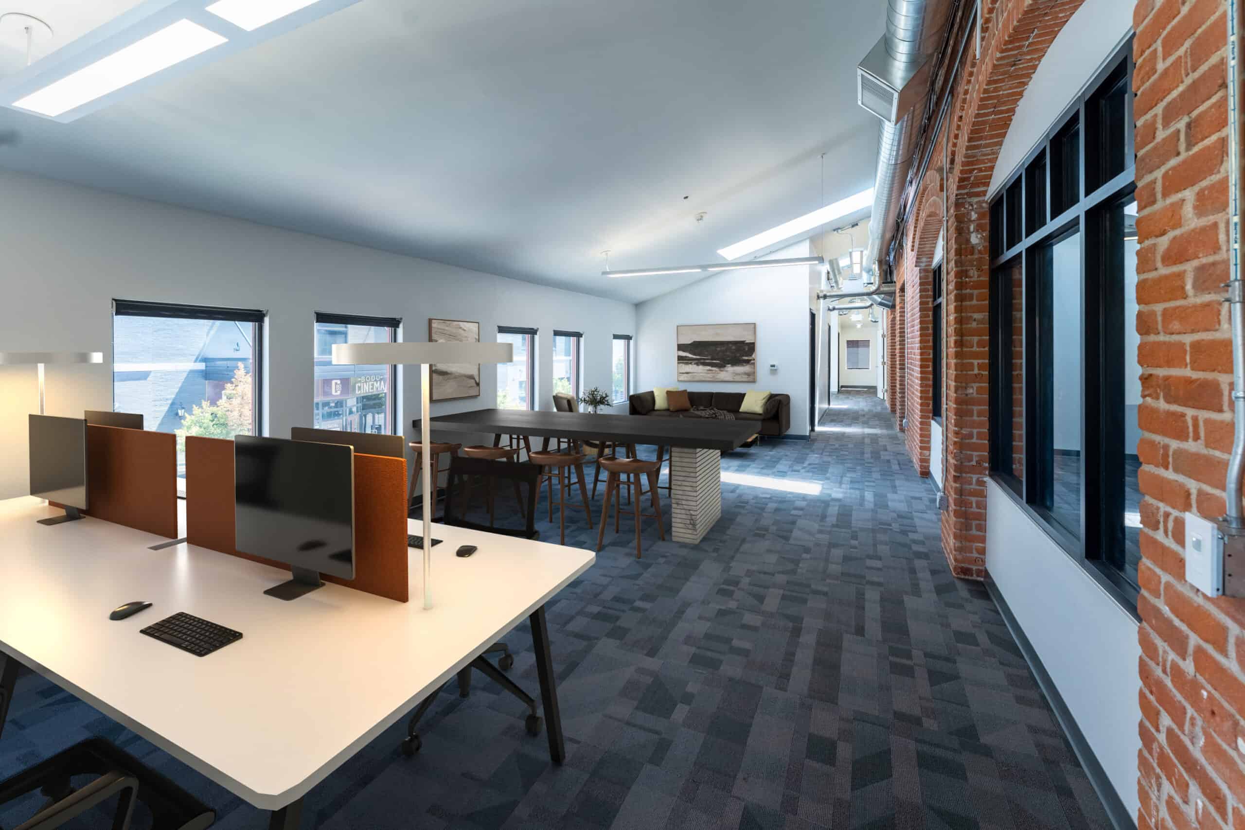 Open workspace inside the Mercantile Building with brick walls